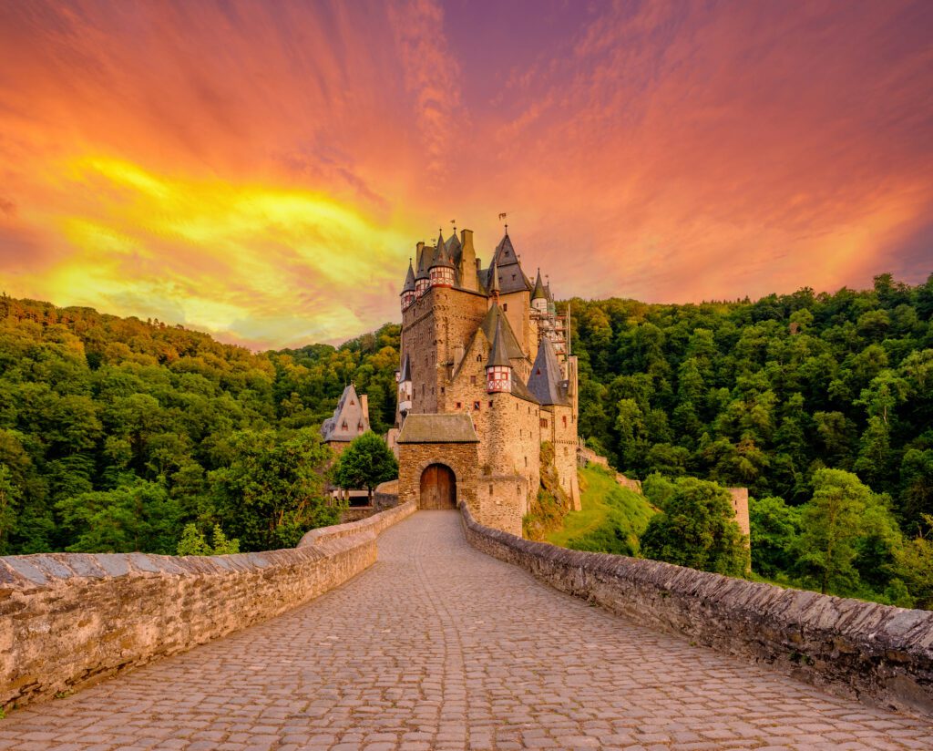 Burg Eltz castle in Rhineland-Palatinate state at sunset, Germany.