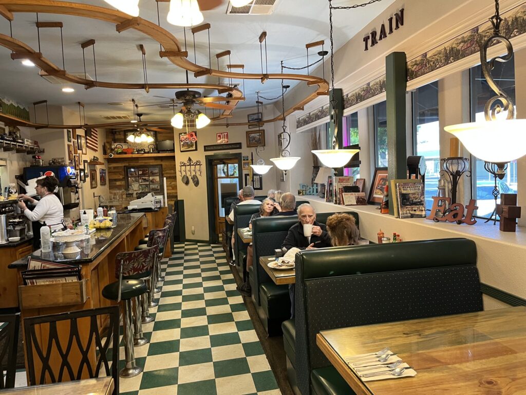 Interior of an old-style diner with counter and stools in Exeter, California
