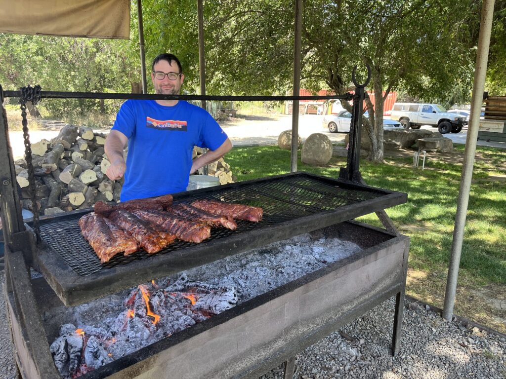 Tri-tip roasting on an open barbecue grill in Three Rivers, California